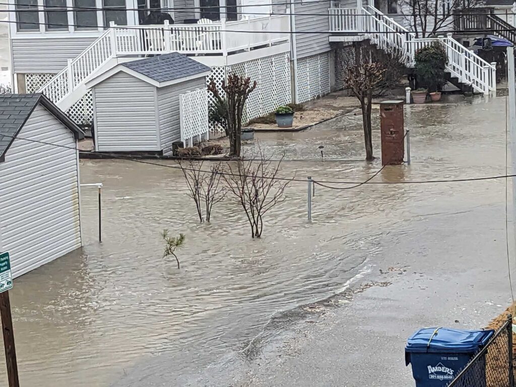 a flooded street with houses (MyCoast AI)