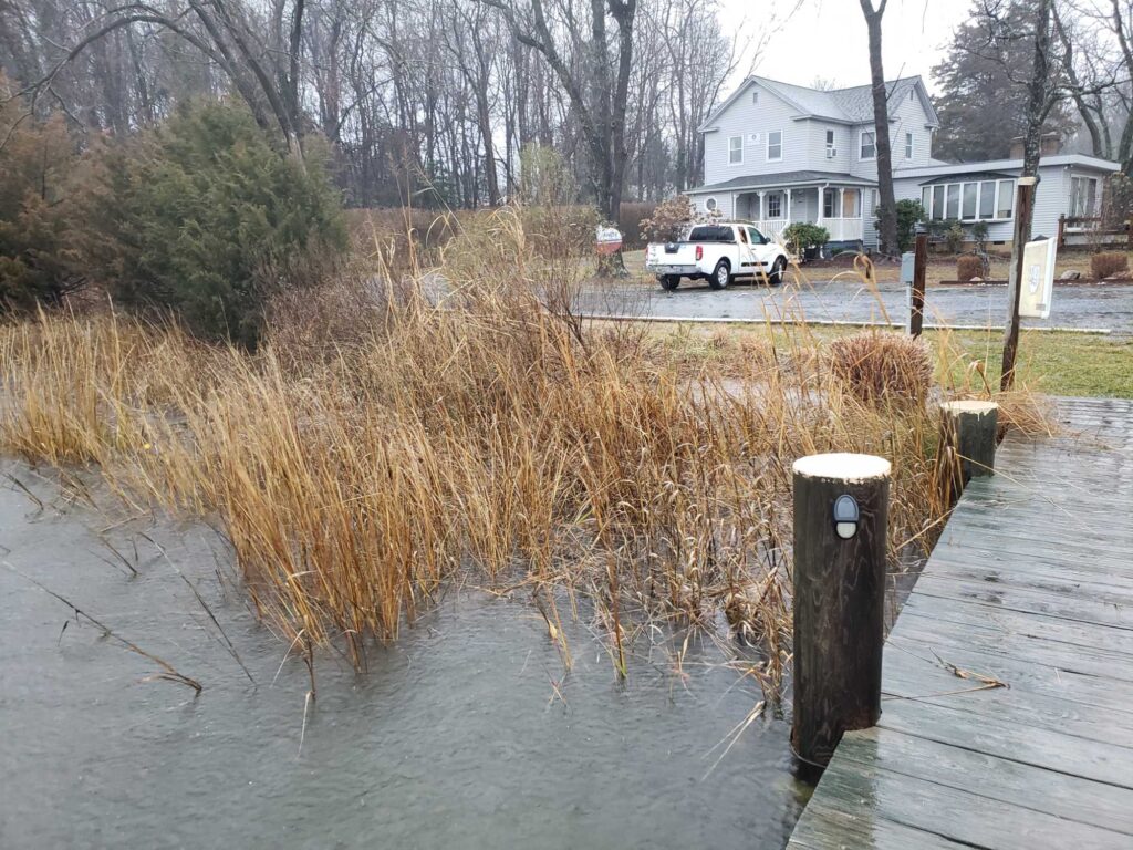 a flooded street with a white truck (MyCoast AI)