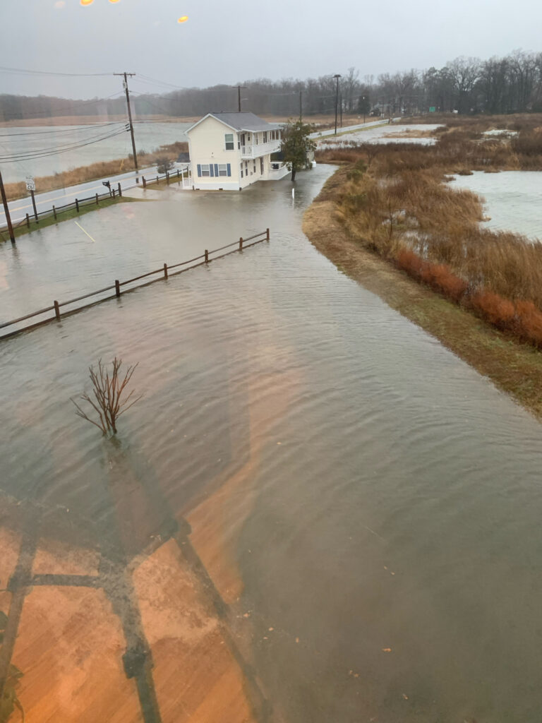 a flooded road with a house (MyCoast AI)