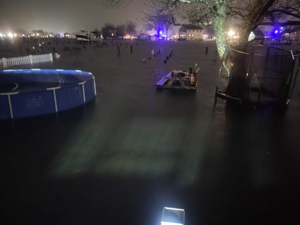a pool with a deck and chairs (MyCoast AI)