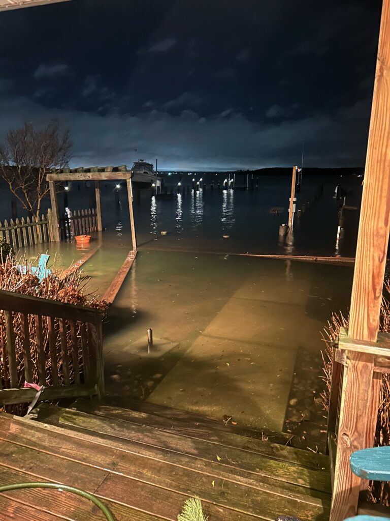a deck with a body of water in the background (MyCoast AI)