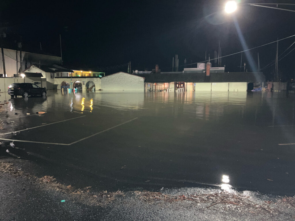 a wet parking lot at night (MyCoast AI)