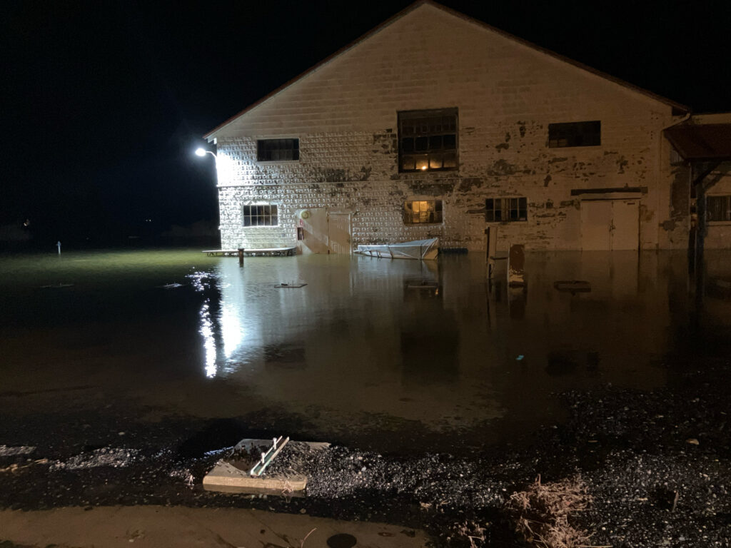 a building with a pool of water in front of it (MyCoast AI)