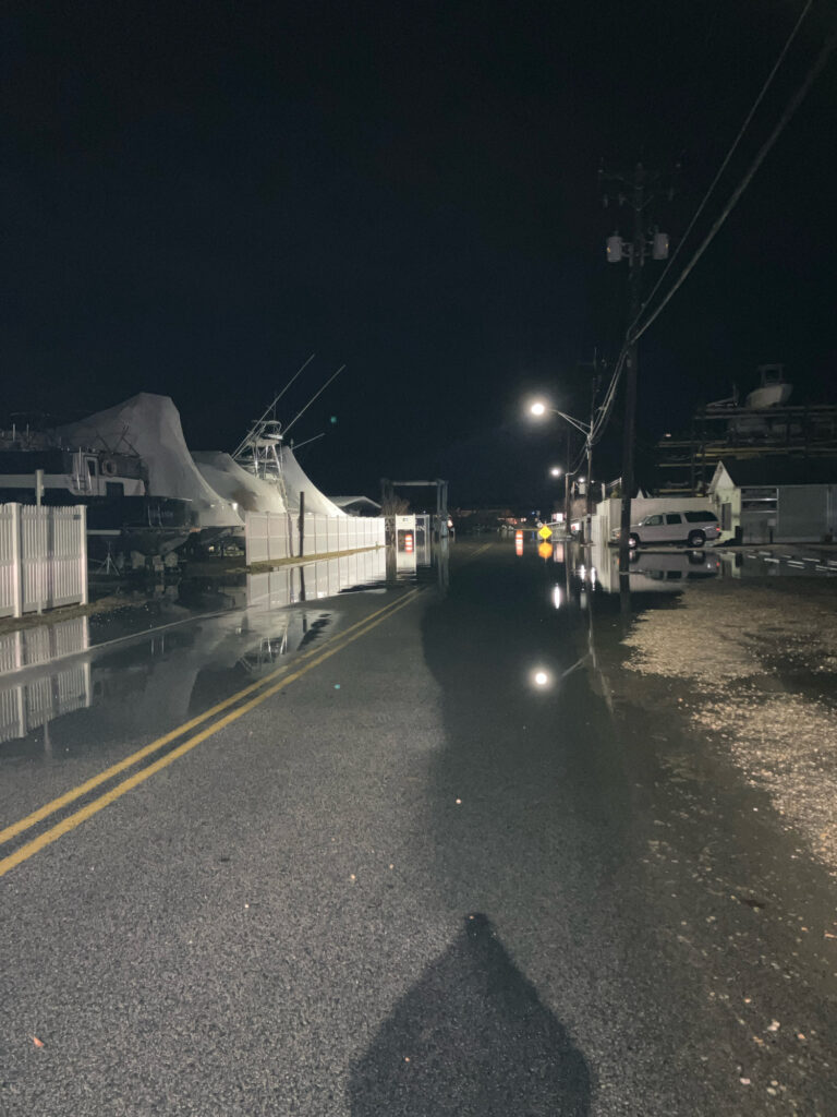 a road with a boat on it and a street light on the side (MyCoast AI)