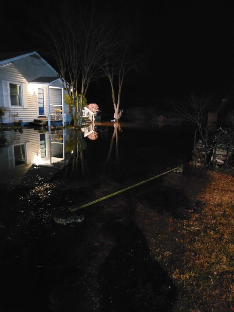a house with a hose in the water at night (MyCoast AI)