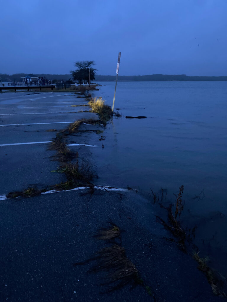 a body of water with a dock and a pole in it (MyCoast AI)