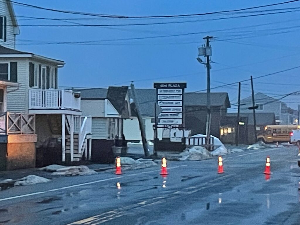 a road with a sign and construction cones on the side (MyCoast AI)