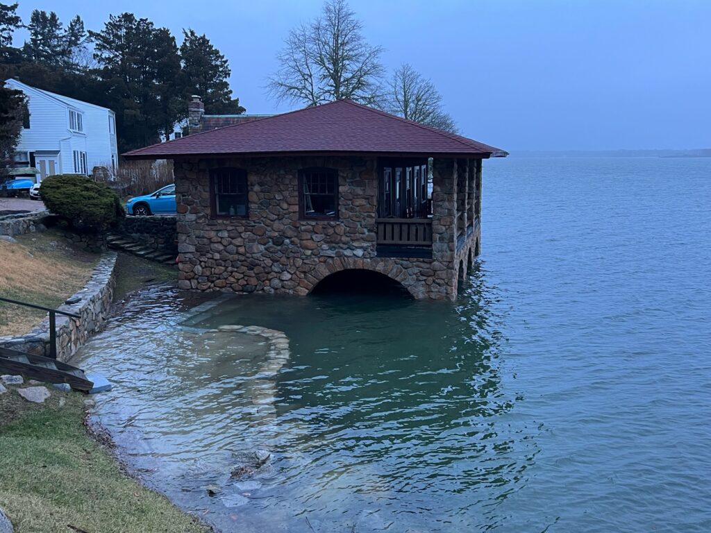 a house on a dock over a body of water (MyCoast AI)