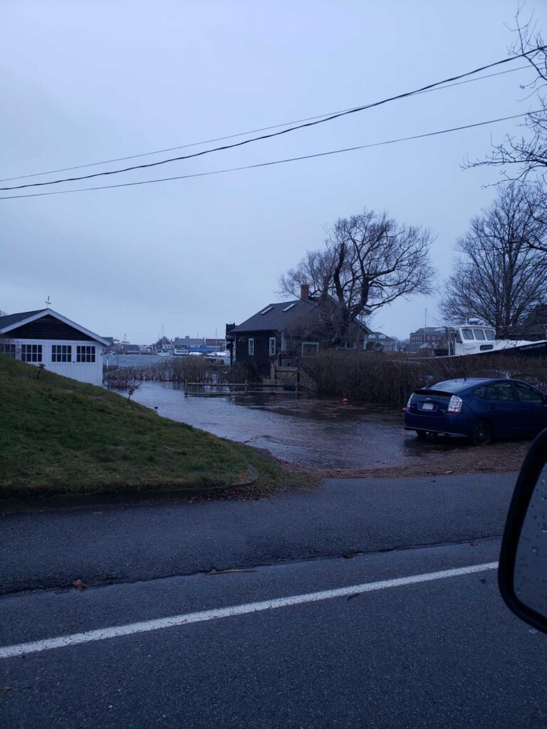 a car parked on the side of a road with houses on the side (MyCoast AI)