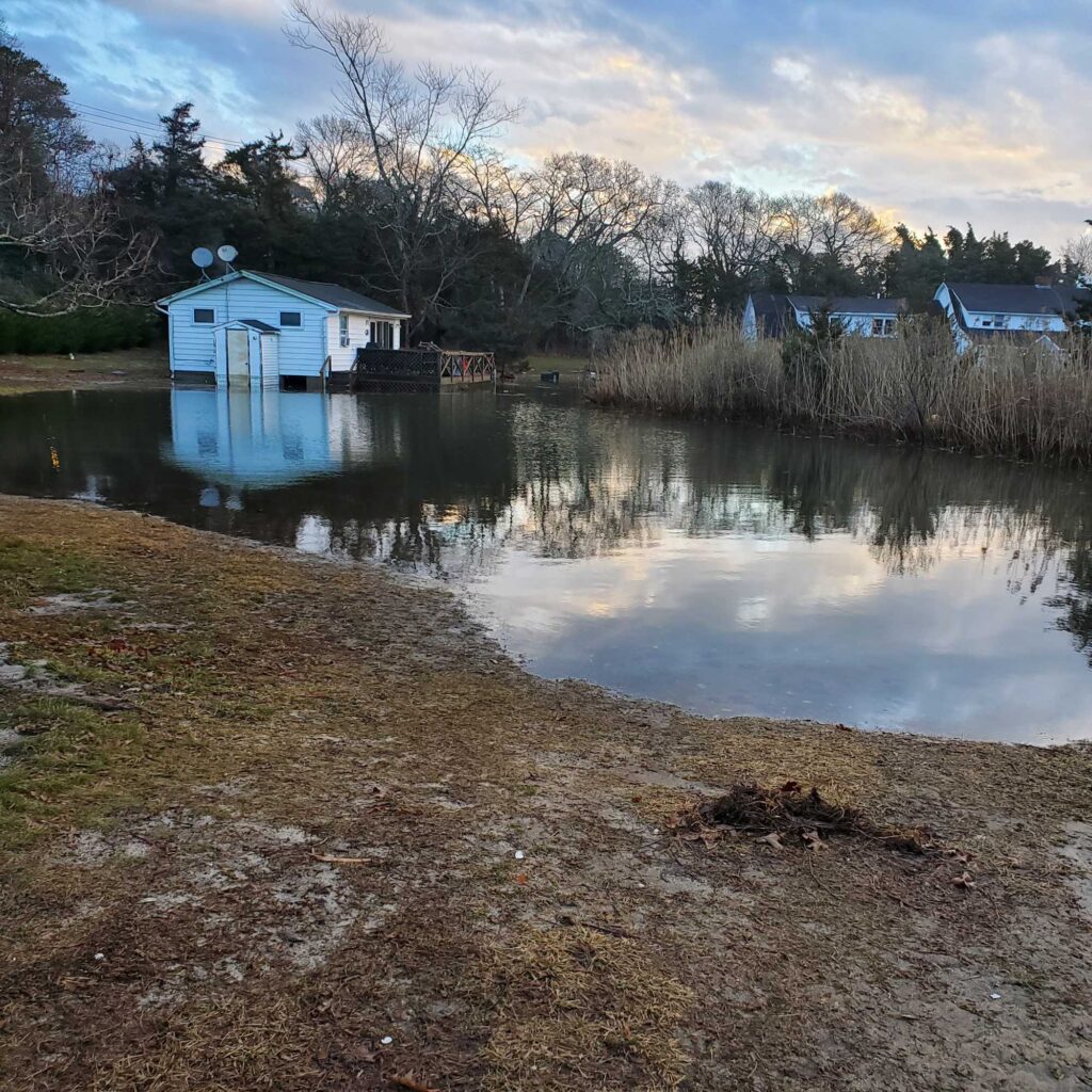a small house on a lake (MyCoast AI)