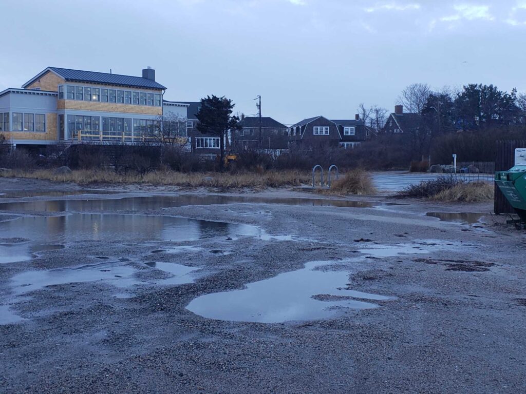 a building with a puddle in front of it (MyCoast AI)