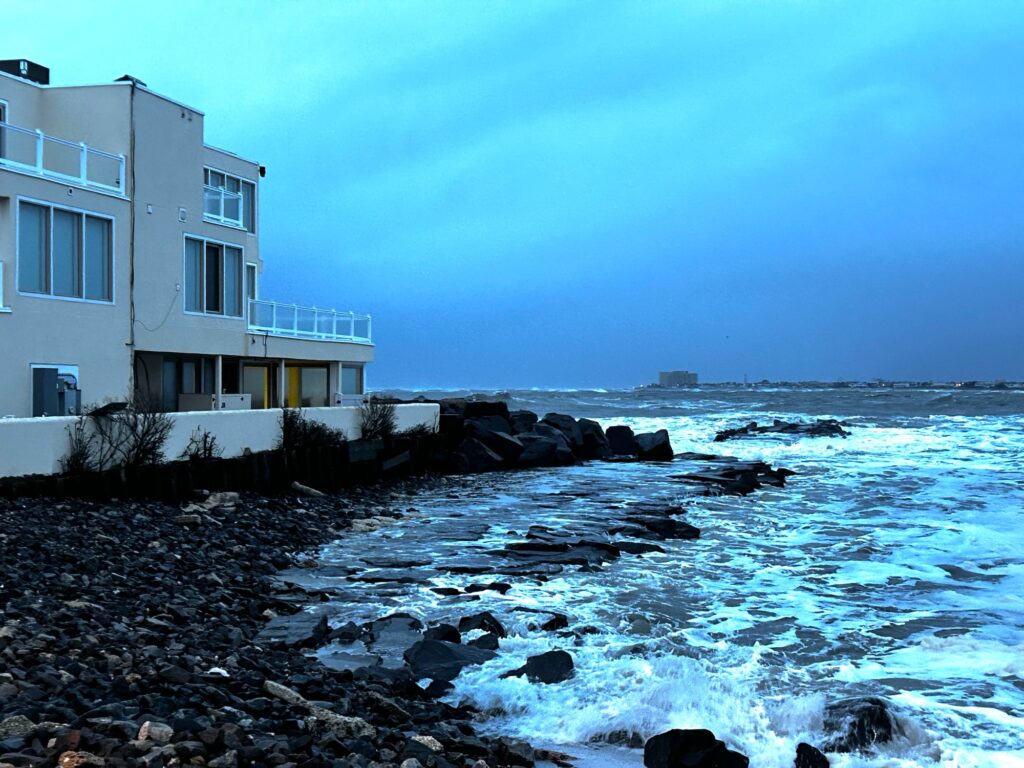 a building next to a body of water (MyCoast AI)