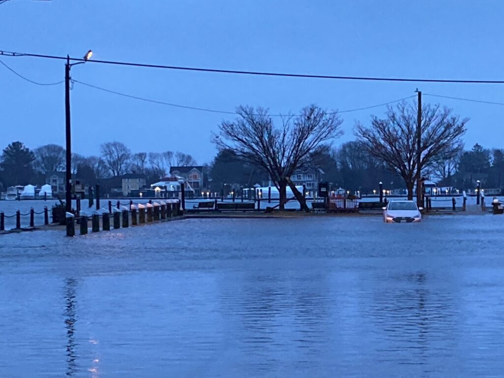a body of water with a boat in it and houses in the back (MyCoast AI)