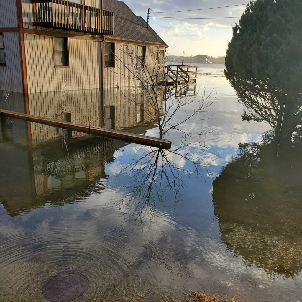 a flooded street with a building (MyCoast AI)