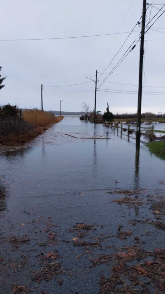 a flooded road with power lines (MyCoast AI)