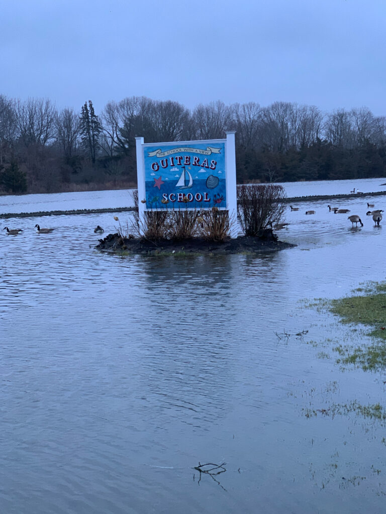 a sign in a lake (MyCoast AI)