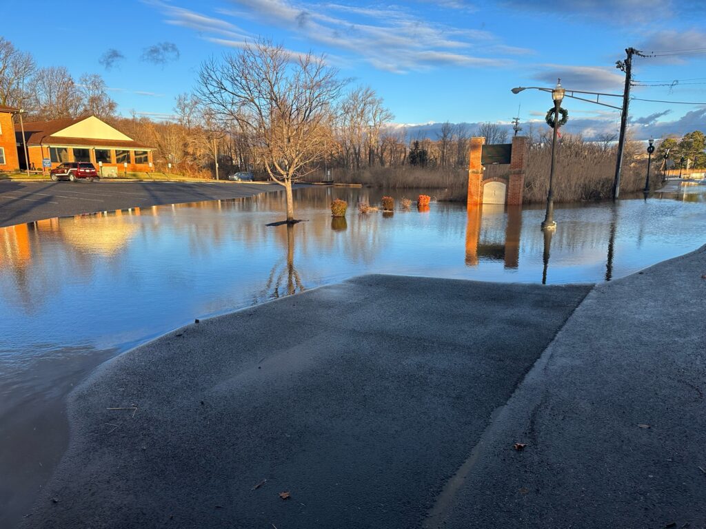 a flooded street with a few buildings (MyCoast AI)