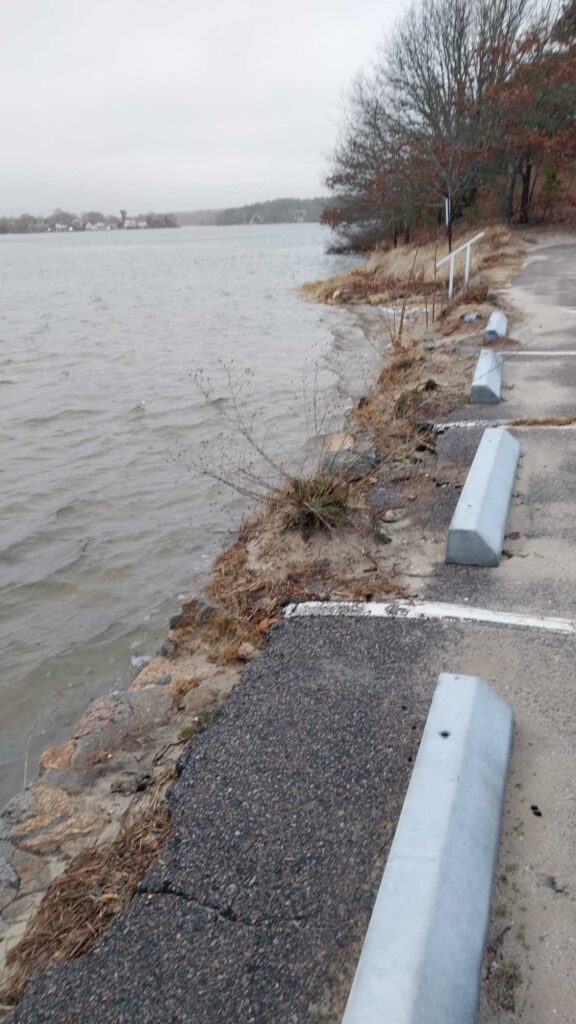 a road next to a body of water (MyCoast AI)