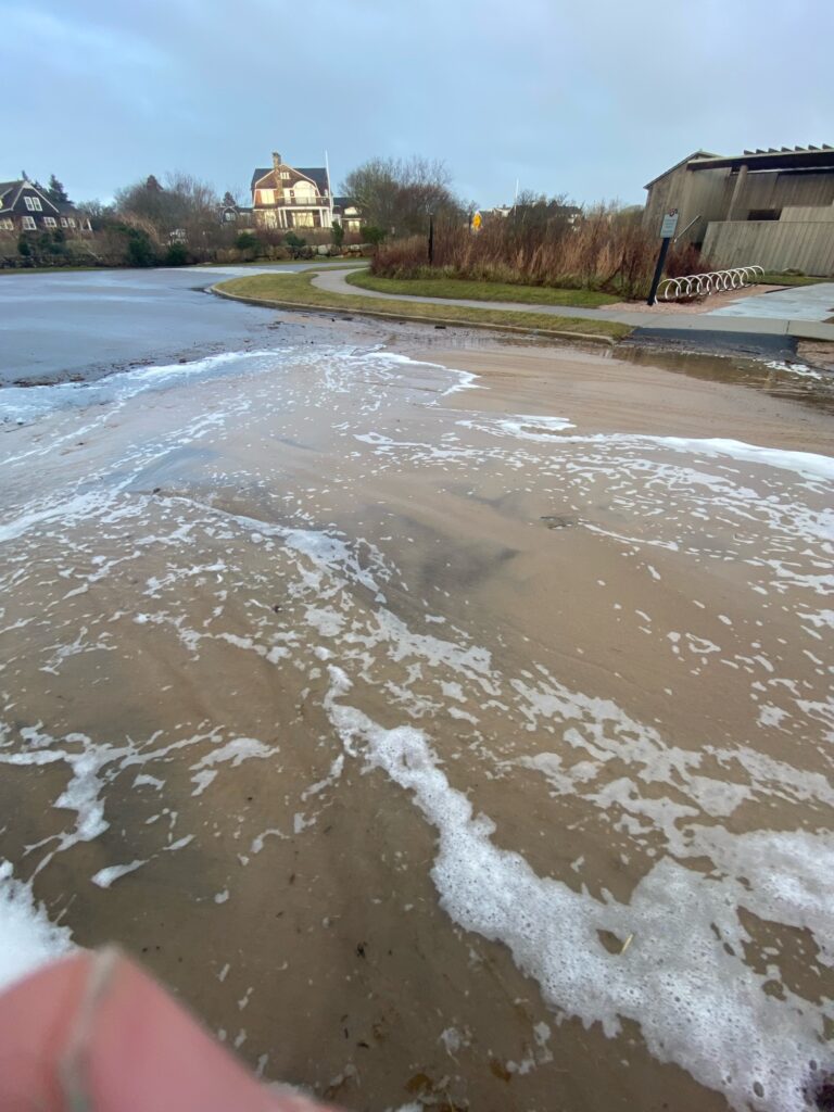 a frozen pond with a building in the background (MyCoast AI)