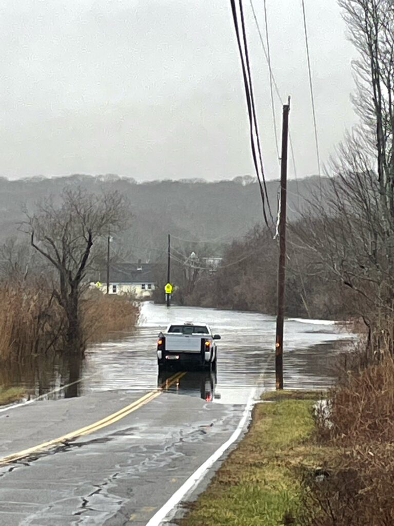 a car driving through a flooded road (MyCoast AI)
