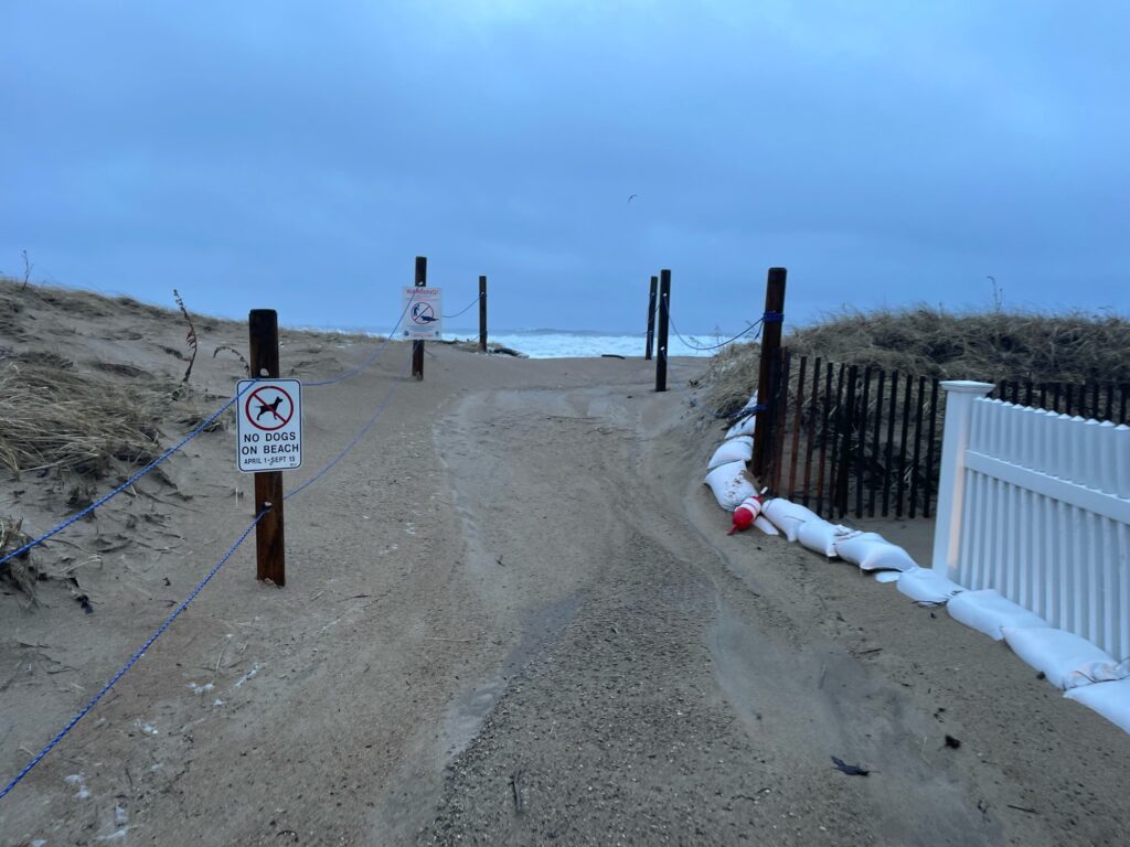 a dirt road with white fences and a white fence (MyCoast AI)