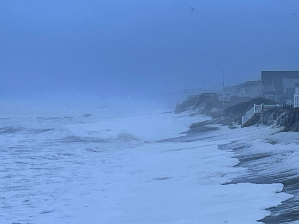 a snowy beach with buildings (MyCoast AI)