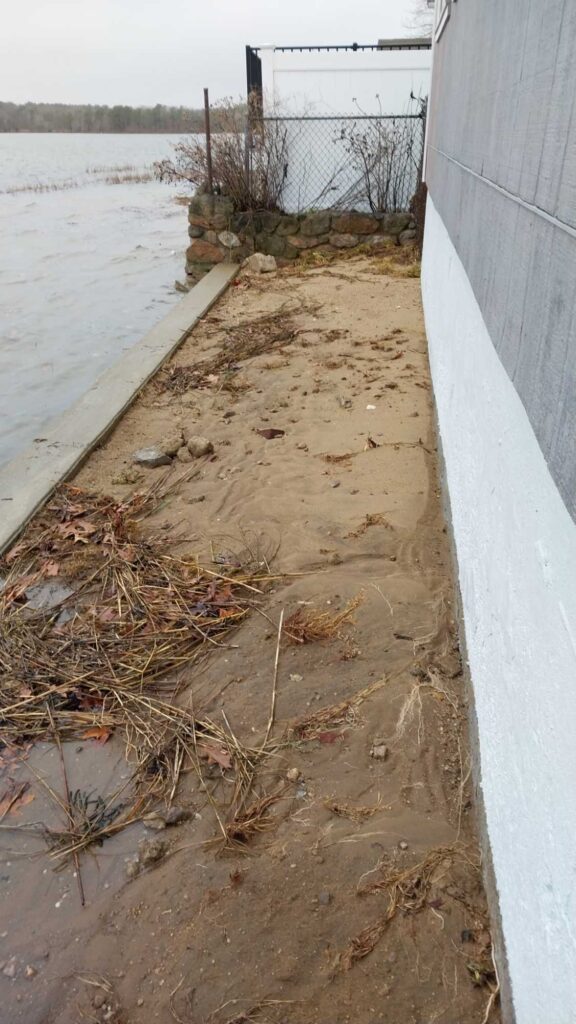 a muddy area next to a building (MyCoast AI)