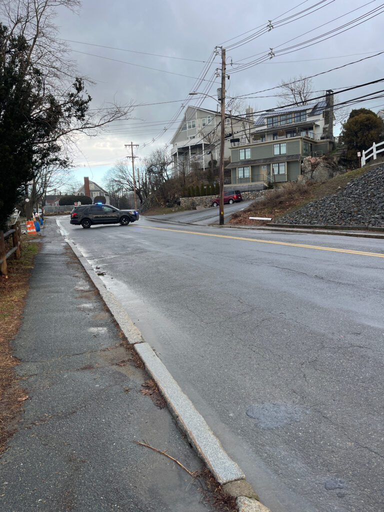 a street with cars parked on the side (MyCoast AI)