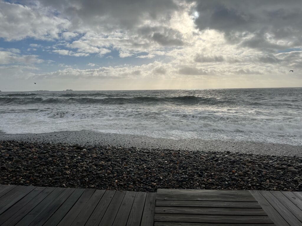 a beach with waves crashing (MyCoast AI)
