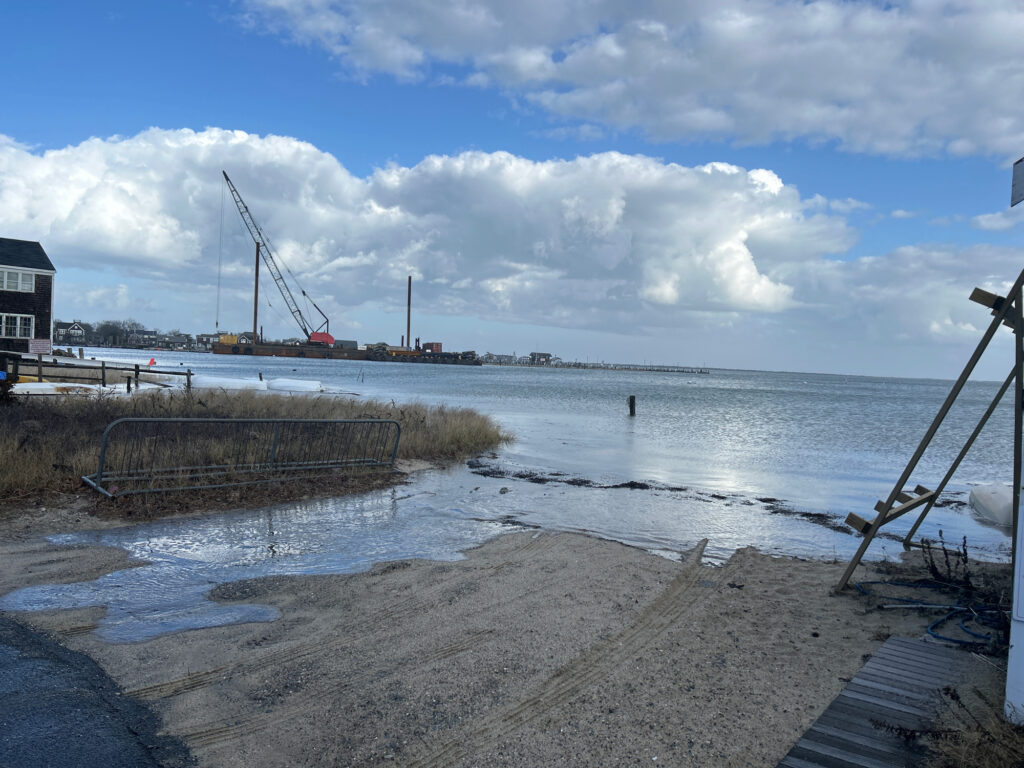 a body of water with cranes and a dock (MyCoast AI)