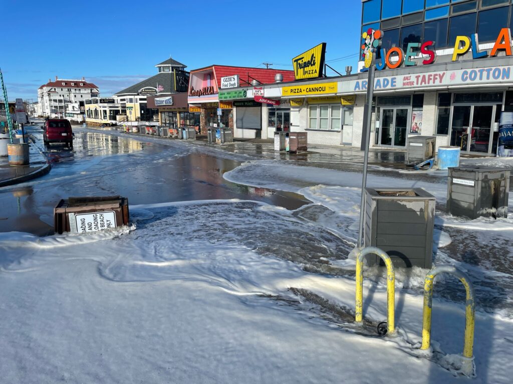 a street with water on the ground (MyCoast AI)