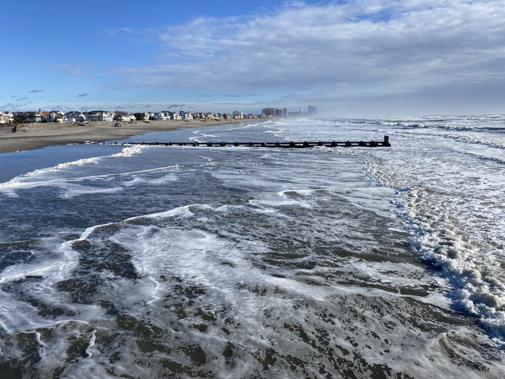 a body of water with waves crashing on it (MyCoast AI)