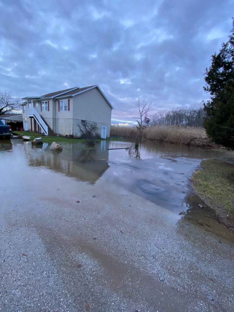 a flooded street with a house (MyCoast AI)