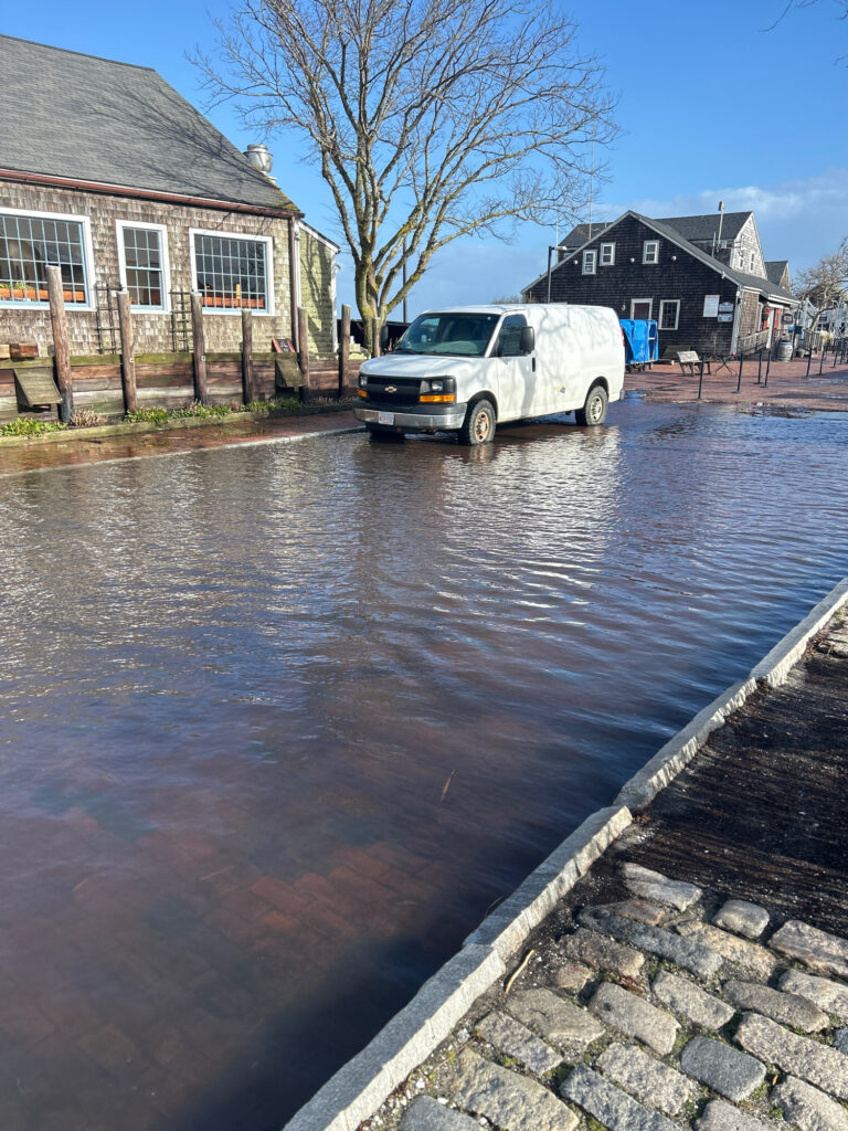 a white truck parked in a flooded street (MyCoast AI)
