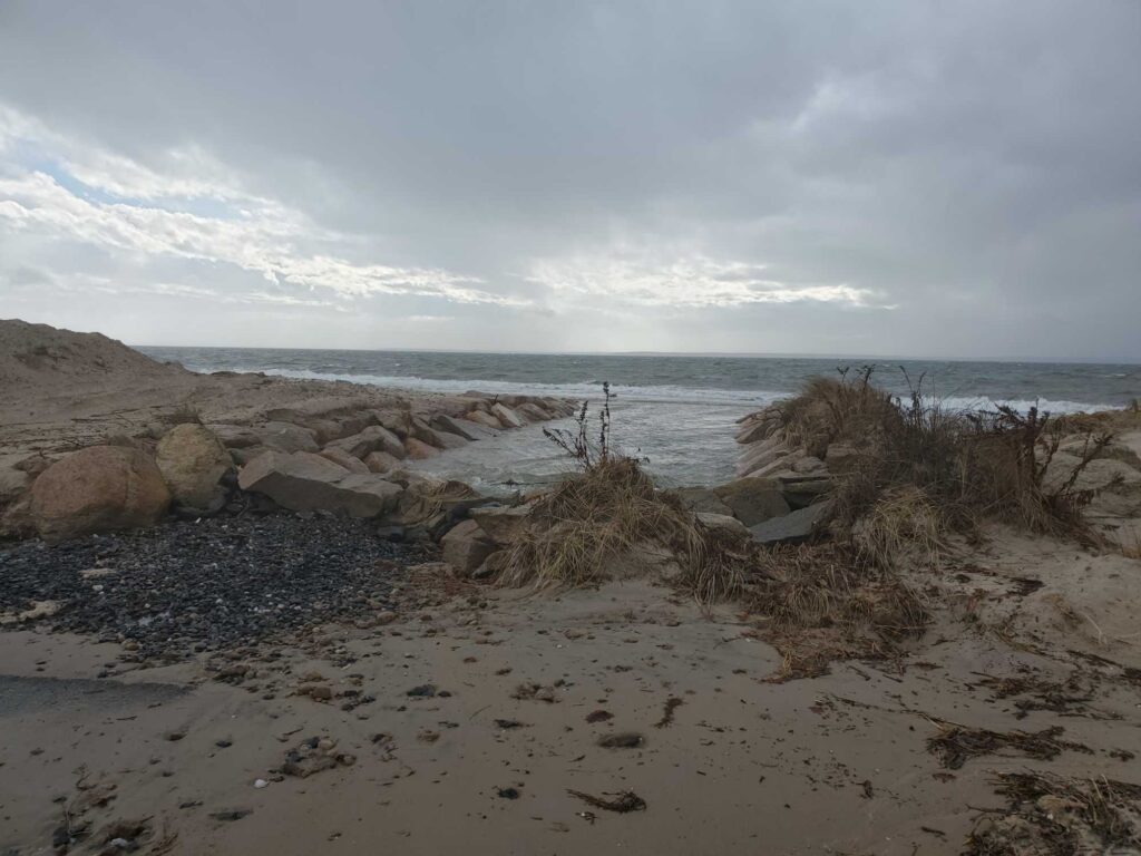 a rocky beach with water in the background (MyCoast AI)