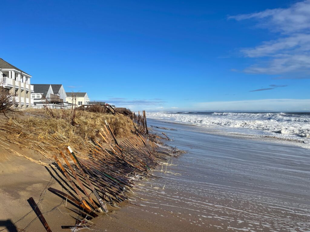 a beach with houses and a body of water (MyCoast AI)
