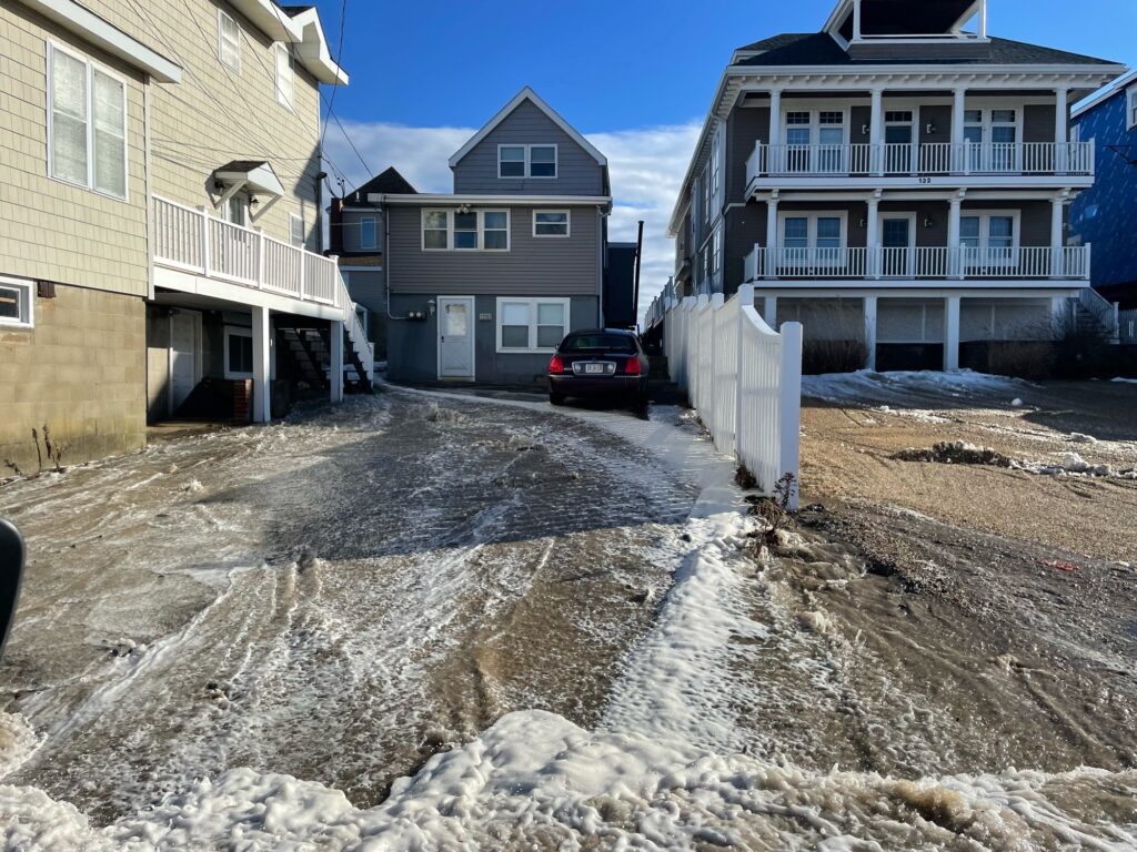 a car parked in a lot with houses in the back (MyCoast AI)