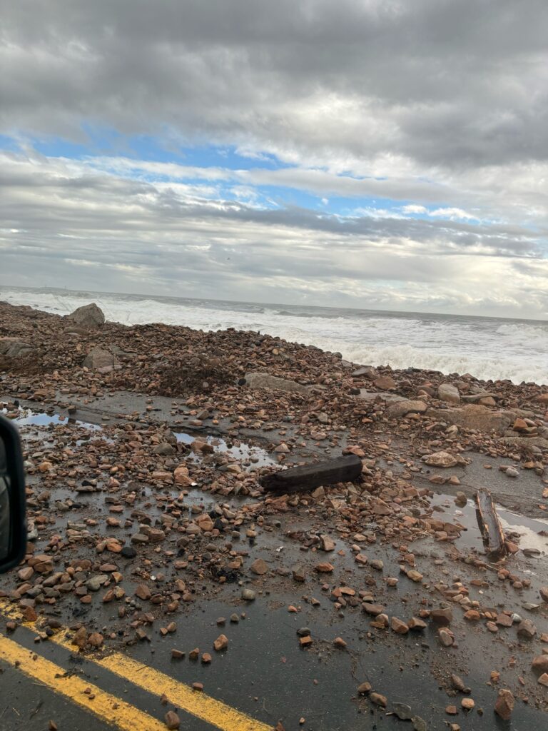 a beach with rocks and a road (MyCoast AI)