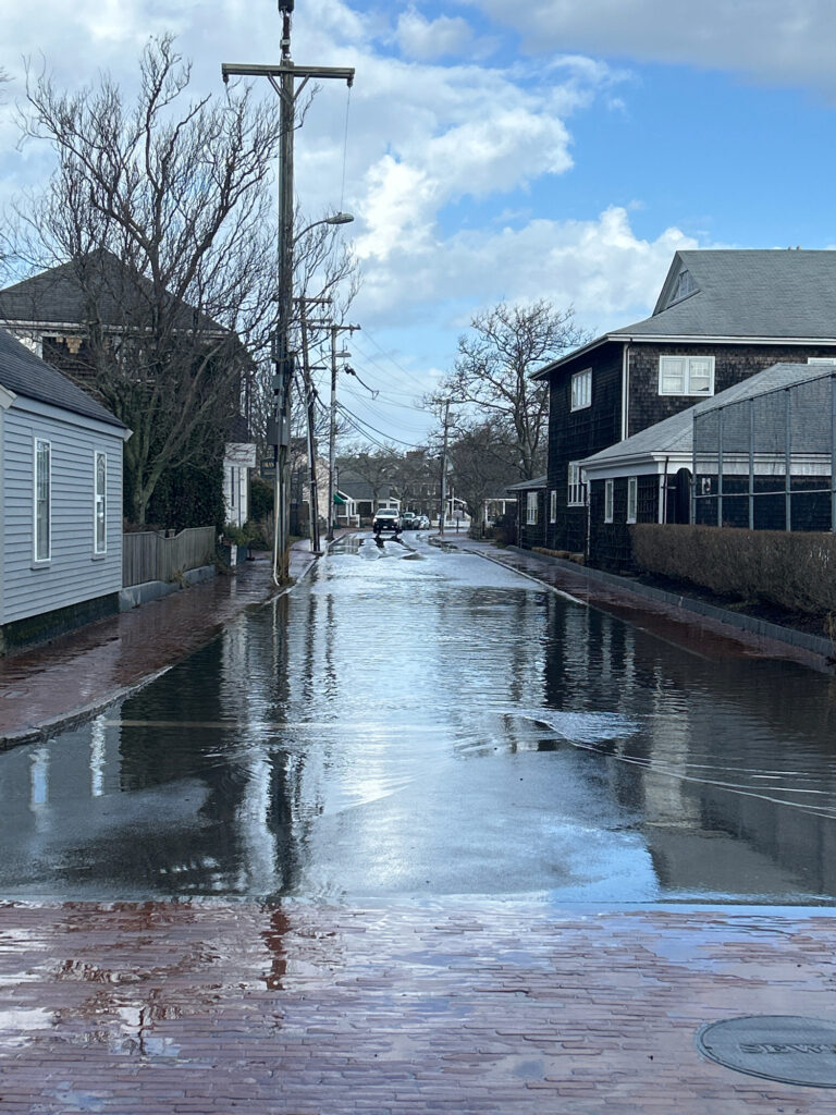 a flooded street with buildings on either side of it (MyCoast AI)