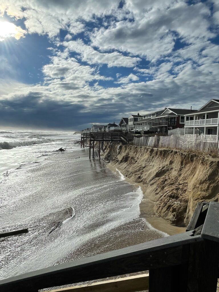a beach with waves crashing against it (MyCoast AI)