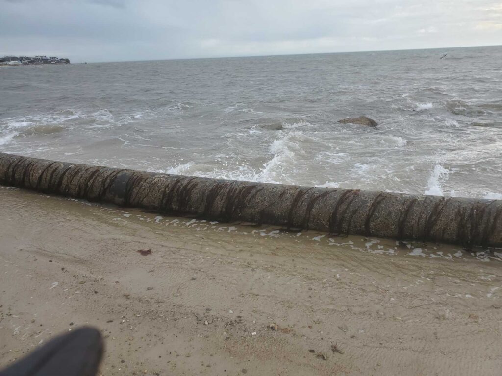 a beach with waves crashing (MyCoast AI)