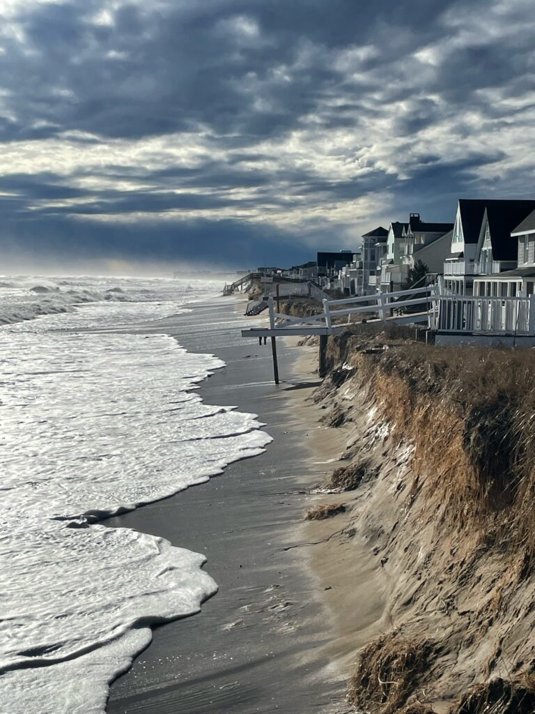 a beach with a pier and buildings (MyCoast AI)