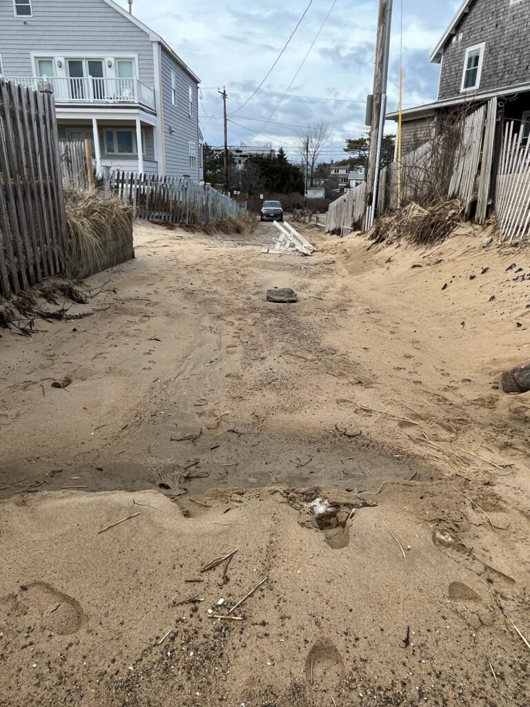 a dirt road with houses on either side of it (MyCoast AI)
