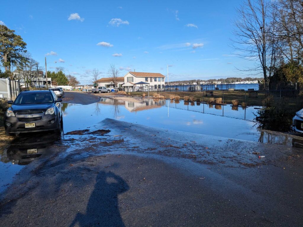 a body of water with cars parked along it (MyCoast AI)