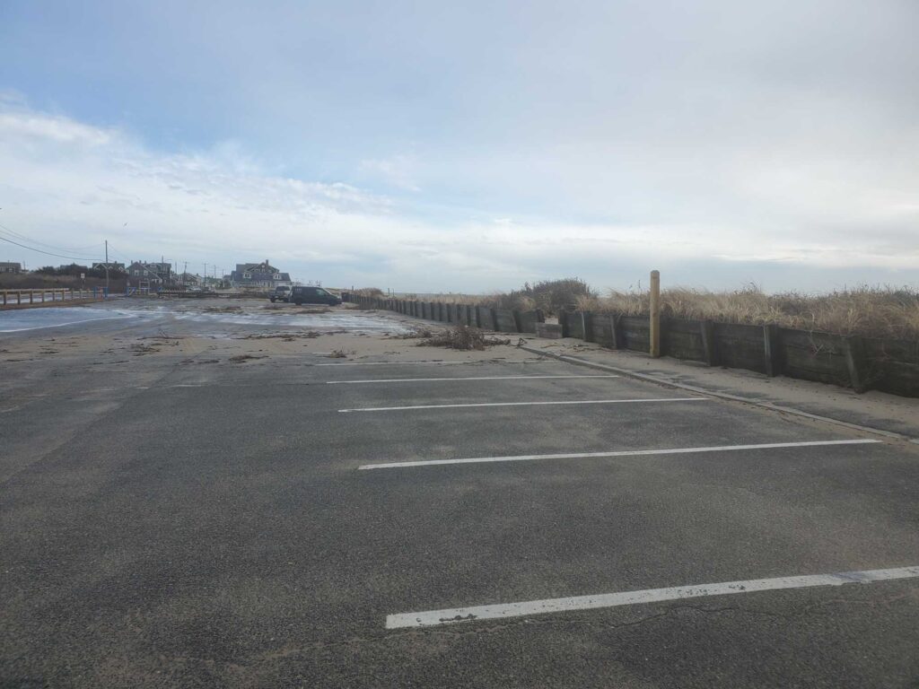 a road with a fence and water on the side (MyCoast AI)