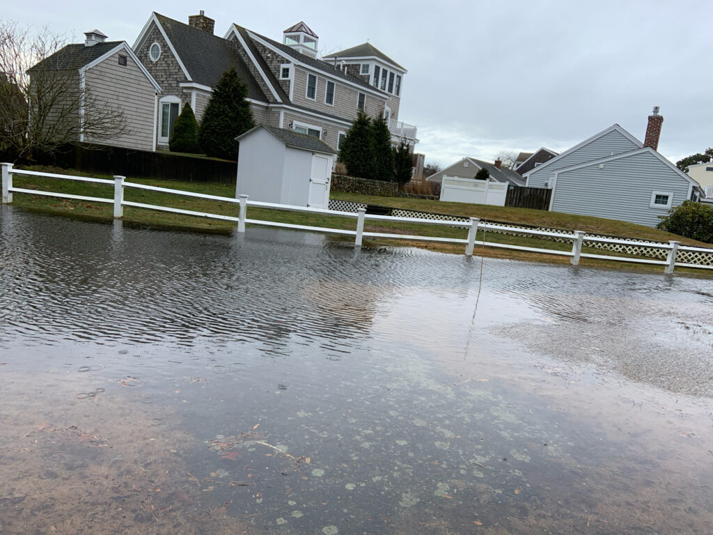 a flooded street with houses (MyCoast AI)