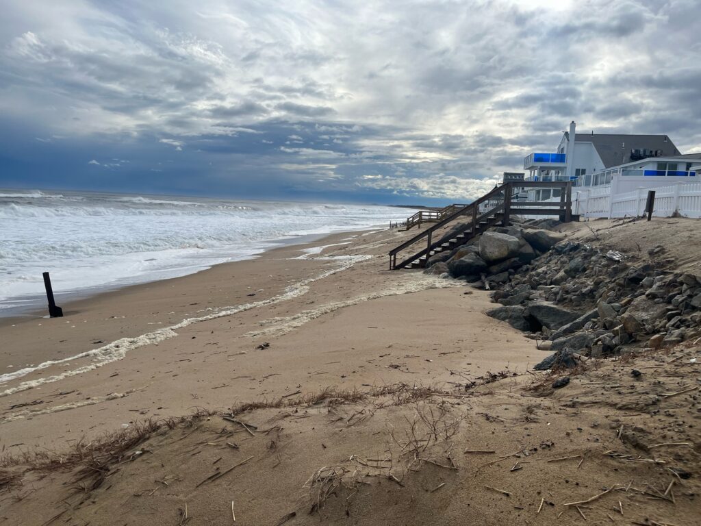 a beach with a building and stairs (MyCoast AI)