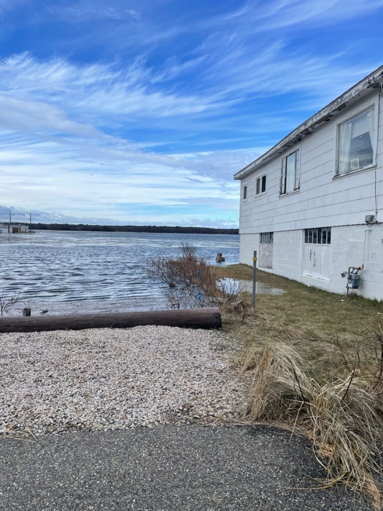 a building next to a body of water (MyCoast AI)