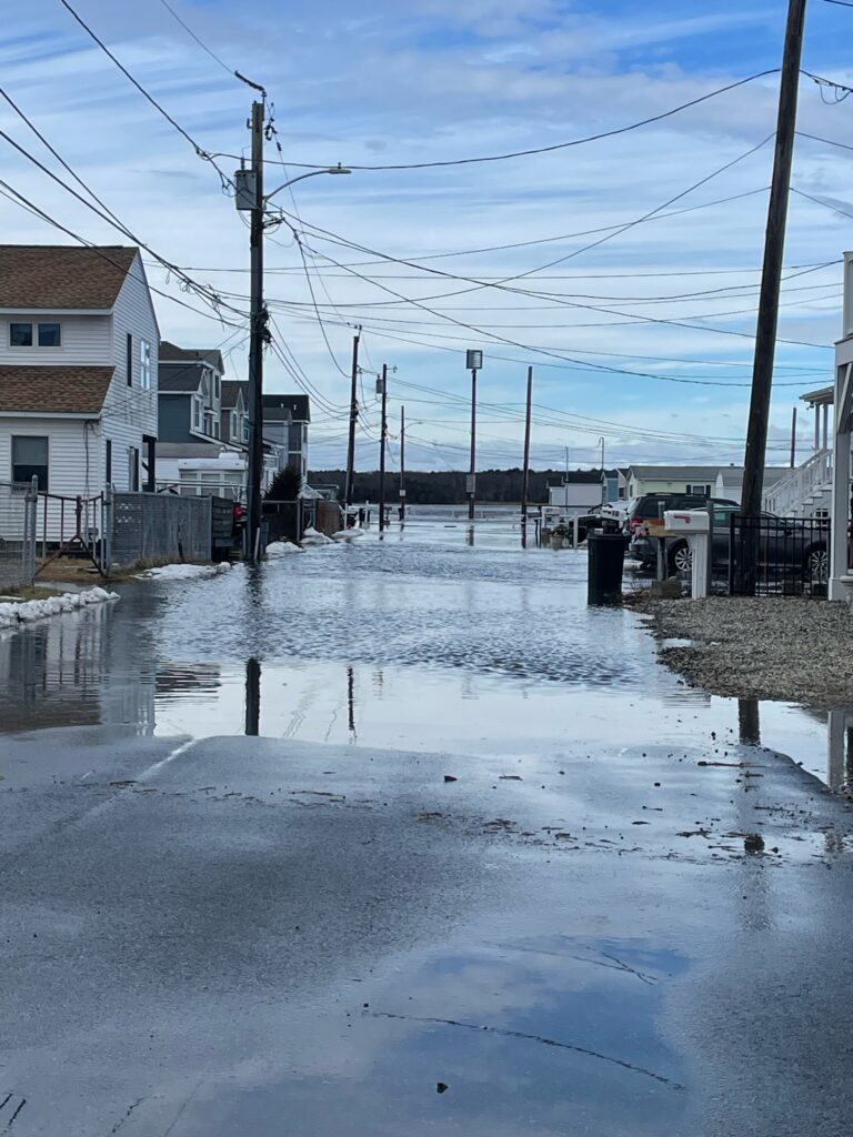 a flooded street with power lines (MyCoast AI)