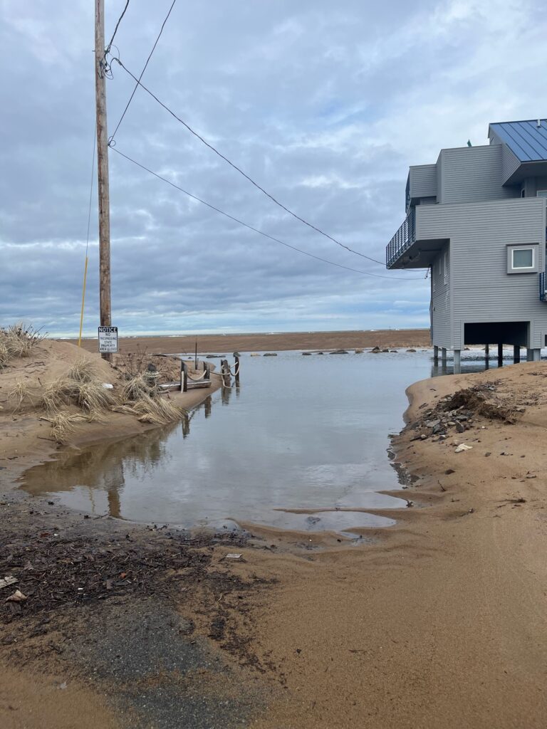 a flooded area with a house and a building (MyCoast AI)